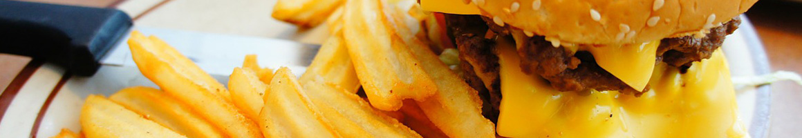 Eating Burger Cuban at Frita's Cuban Burgers restaurant in Key West, FL.